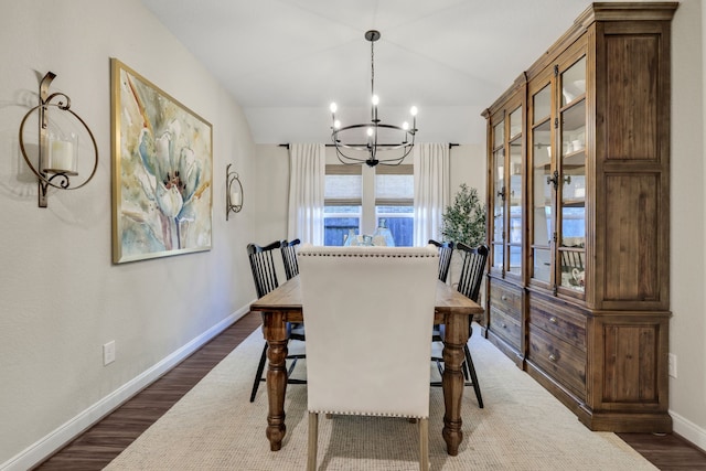 21310 Baldovin Way, Tomball, TX 77375 - dining space with dark wood-type flooring, a chandelier, baseboards, and vaulted ceiling