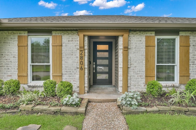 2806 Triway Ln, Houston, TX 77043 - view of exterior entry with brick siding and roof with shingles