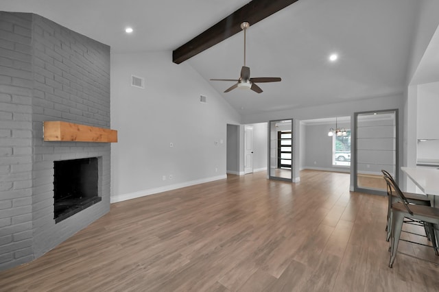 2806 Triway Ln, Houston, TX 77043 - unfurnished living room featuring ceiling fan, a fireplace, beamed ceiling, high vaulted ceiling, and baseboards