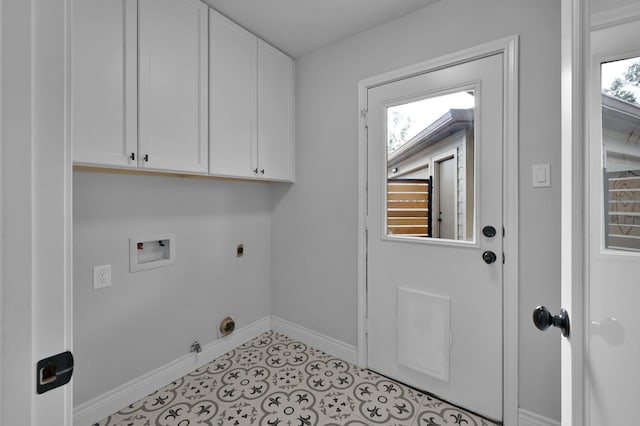2806 Triway Ln, Houston, TX 77043 - washroom featuring cabinet space, hookup for an electric dryer, washer hookup, hookup for a gas dryer, and baseboards