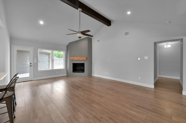 2806 Triway Ln, Houston, TX 77043 - unfurnished living room with ceiling fan, light wood-type flooring, a brick fireplace, baseboards, and recessed lighting