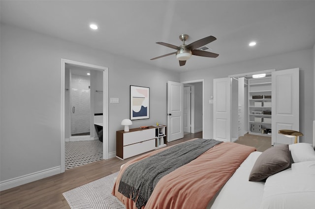 2806 Triway Ln, Houston, TX 77043 - bedroom featuring recessed lighting, a spacious closet, wood finished floors, baseboards, and a closet