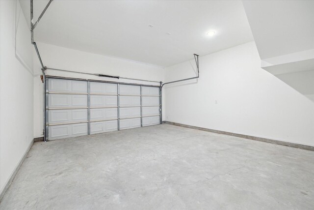 927 Bianco Ln, Houston, TX 77091 - garage featuring baseboards