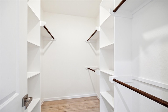 927 Bianco Ln, Houston, TX 77091 - walk in closet featuring light wood finished floors