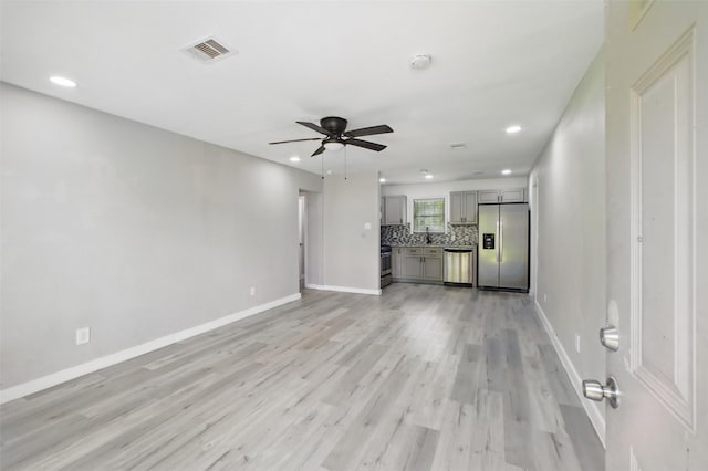 3221 Texas Ave, Texas City, TX 77590 - unfurnished living room with ceiling fan, light wood-type flooring, and recessed lighting