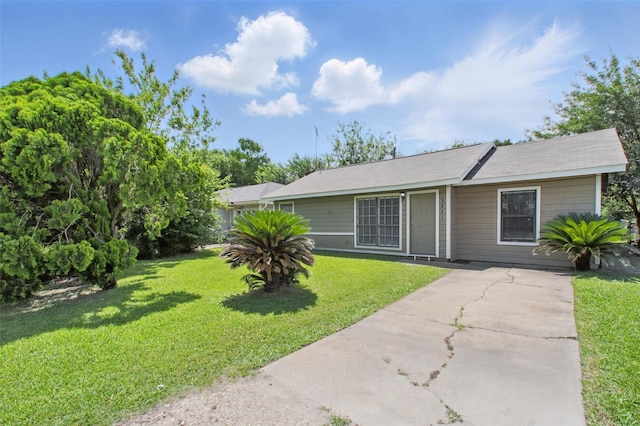 3221 Texas Ave, Texas City, TX 77590 - view of front of home with a front lawn and concrete driveway