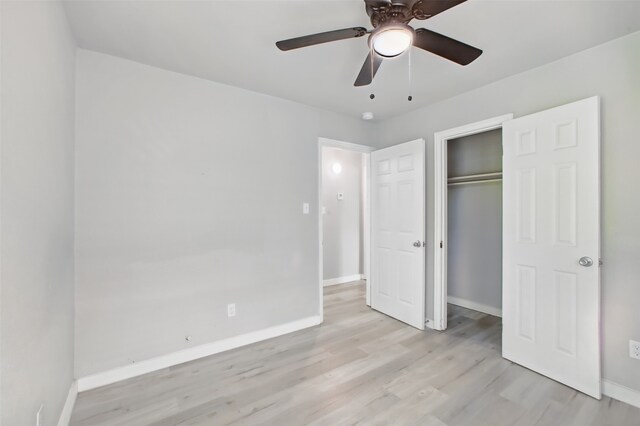 3221 Texas Ave, Texas City, TX 77590 - unfurnished bedroom with light wood-style floors, a closet, and ceiling fan