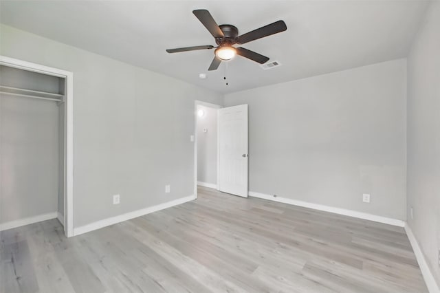 3221 Texas Ave, Texas City, TX 77590 - unfurnished bedroom featuring wood finished floors, a closet, and a ceiling fan