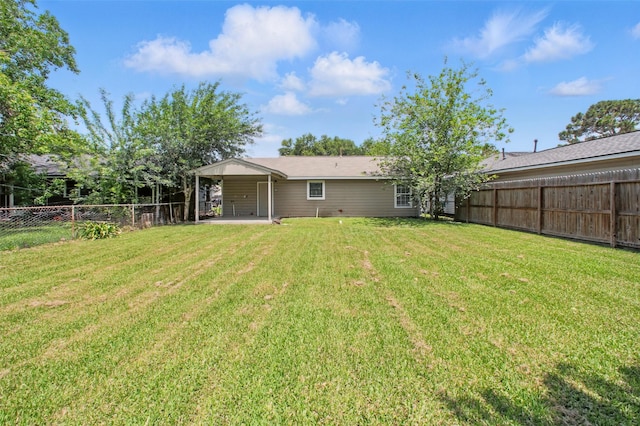 3221 Texas Ave, Texas City, TX 77590 - fenced backyard featuring a patio area