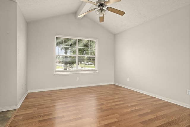 unfurnished room featuring a textured ceiling, a ceiling fan, wood finished floors, and baseboards