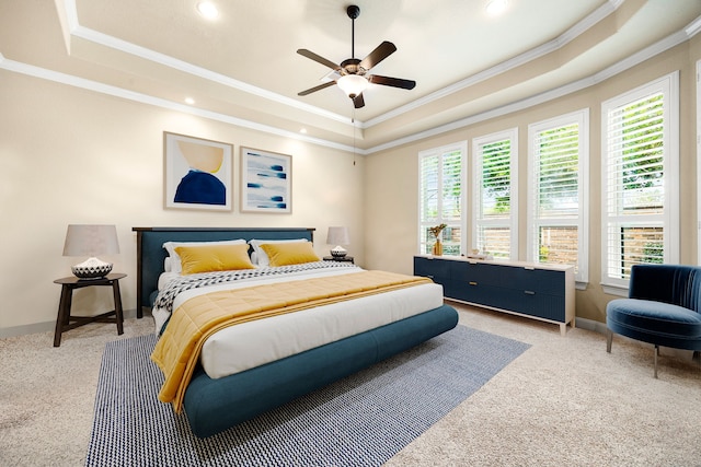 bedroom with a raised ceiling, crown molding, light colored carpet, recessed lighting, and baseboards