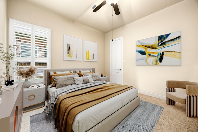 carpeted bedroom with ceiling fan