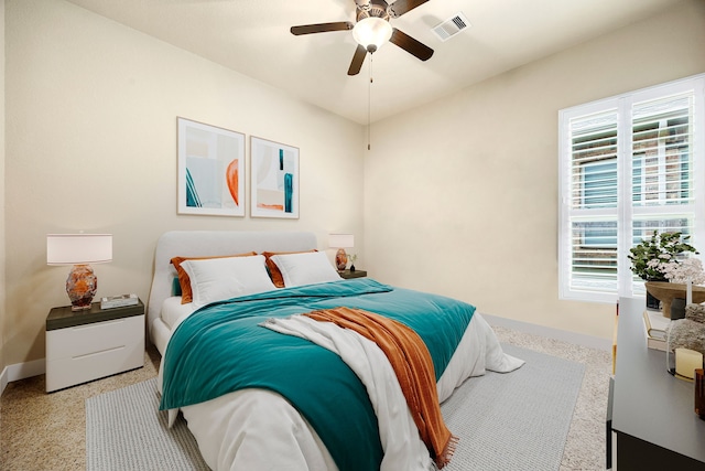 bedroom with multiple windows, baseboards, and ceiling fan