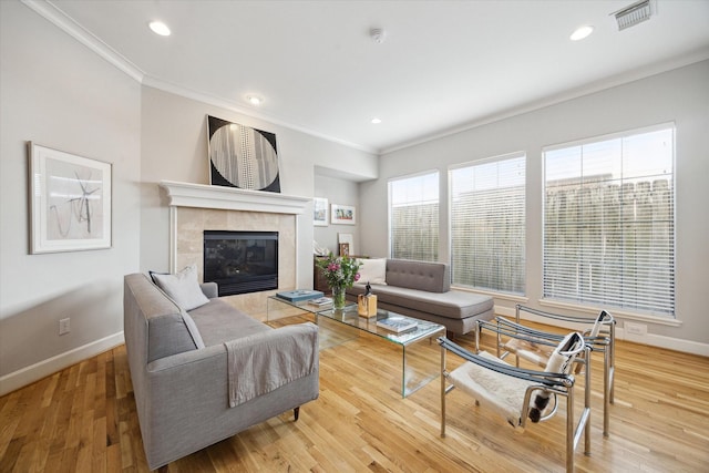 4005 Gramercy St, Houston, TX 77025 - living area with ornamental molding, baseboards, light wood-style floors, a fireplace, and recessed lighting
