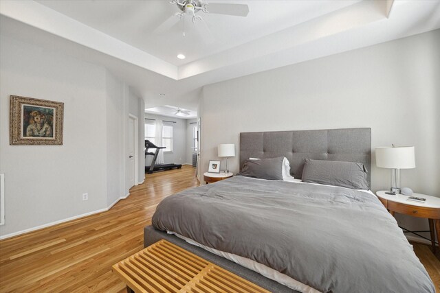 4005 Gramercy St, Houston, TX 77025 - bedroom with wood finished floors, baseboards, a raised ceiling, recessed lighting, and ceiling fan