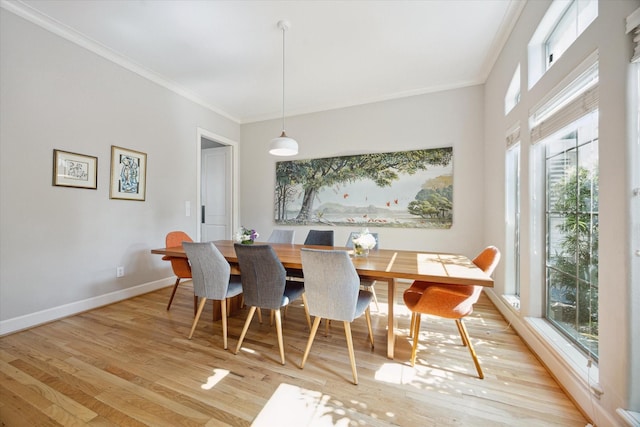 4005 Gramercy St, Houston, TX 77025 - dining room with light wood finished floors, ornamental molding, and baseboards