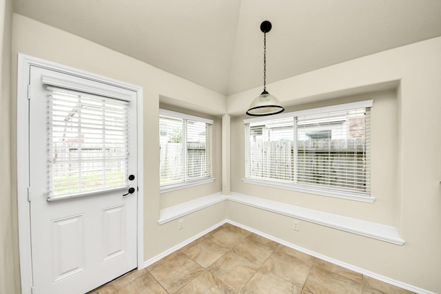 2614 Leopard Ct, Katy, TX 77449 - unfurnished dining area featuring baseboards and vaulted ceiling