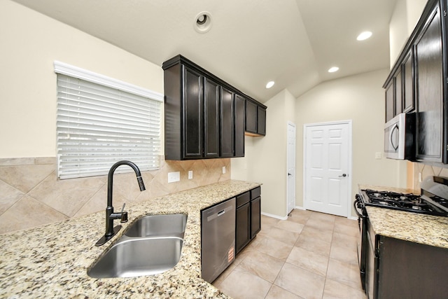 2614 Leopard Ct, Katy, TX 77449 - kitchen with appliances with stainless steel finishes, a sink, recessed lighting, light stone countertops, and decorative backsplash