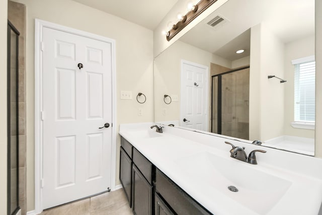 2614 Leopard Ct, Katy, TX 77449 - full bath featuring a shower stall, tile patterned floors, and double vanity