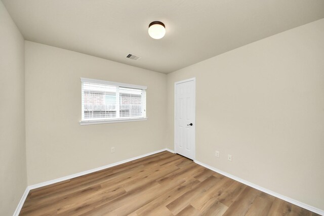 2614 Leopard Ct, Katy, TX 77449 - empty room with baseboards and wood finished floors