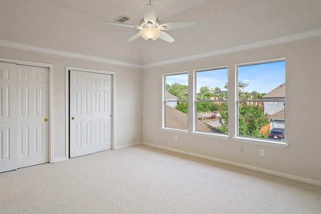 1383 El Camino Village Dr, Webster, TX 77058 - unfurnished bedroom with multiple closets, carpet, baseboards, and ceiling fan