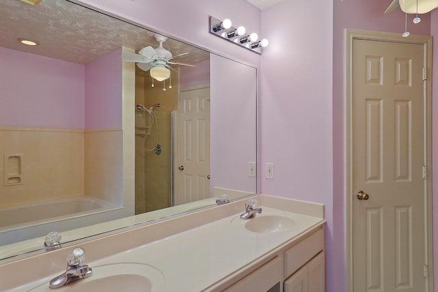 1383 El Camino Village Dr, Webster, TX 77058 - full bathroom featuring a ceiling fan, double vanity, a shower, and a tub to relax in
