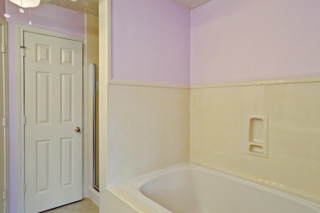 1383 El Camino Village Dr, Webster, TX 77058 - full bathroom featuring a bath and an enclosed shower
