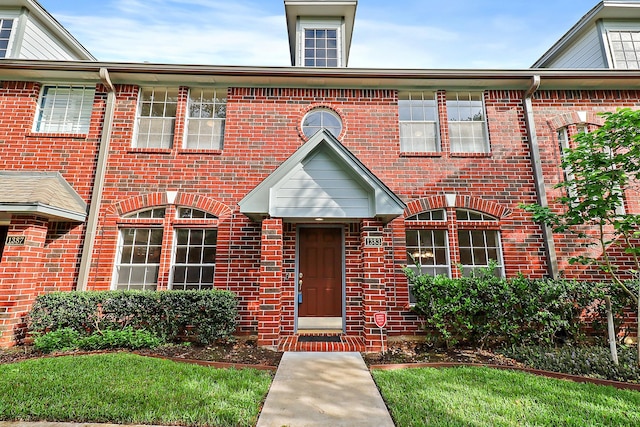 1383 El Camino Village Dr, Webster, TX 77058 - view of front facade with brick siding and a front yard