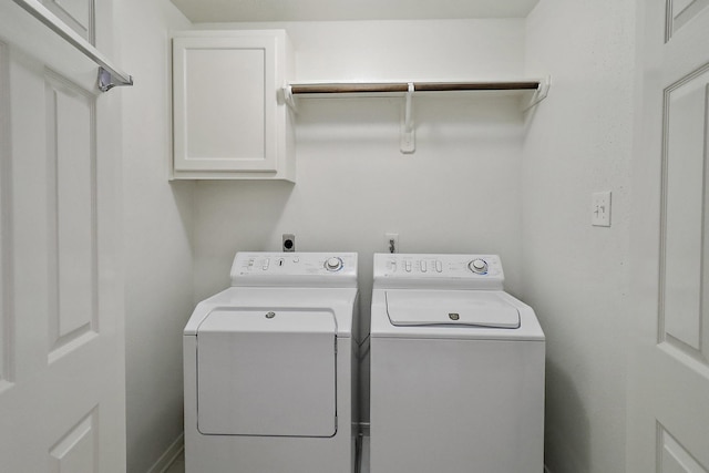 1383 El Camino Village Dr, Webster, TX 77058 - laundry area with cabinet space and separate washer and dryer