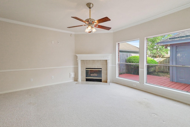 1383 El Camino Village Dr, Webster, TX 77058 - unfurnished living room with a tiled fireplace, carpet, crown molding, baseboards, and a ceiling fan