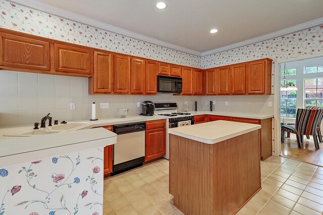 1383 El Camino Village Dr, Webster, TX 77058 - kitchen with dishwashing machine, black microwave, light countertops, ornamental molding, and white range with gas cooktop