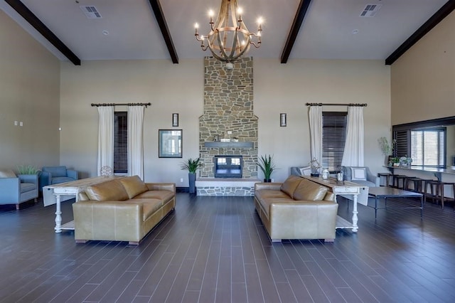 28437 Ofallon Mills Dr, Spring, TX 77386 - living room featuring a high ceiling, beamed ceiling, a chandelier, dark wood-style flooring, and a stone fireplace