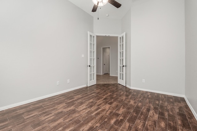 28437 Ofallon Mills Dr, Spring, TX 77386 - spare room with french doors, dark wood-style flooring, a ceiling fan, baseboards, and a high ceiling