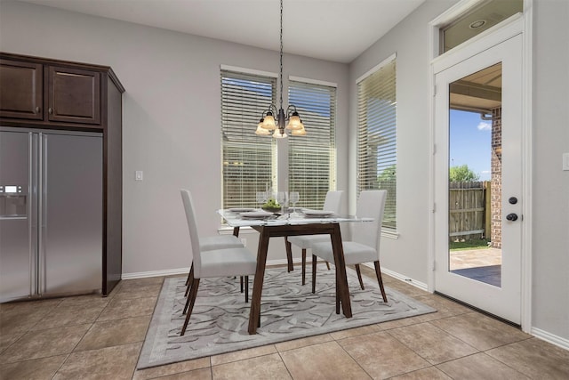 28437 Ofallon Mills Dr, Spring, TX 77386 - dining space with a chandelier, light tile patterned floors, and baseboards