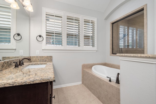 28437 Ofallon Mills Dr, Spring, TX 77386 - full bathroom with a garden tub, tile patterned flooring, vanity, and baseboards