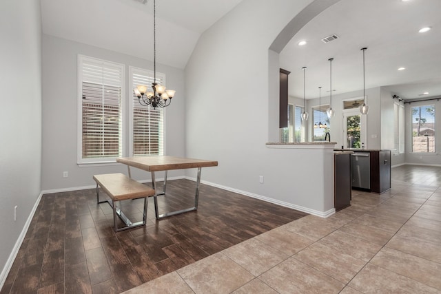 28437 Ofallon Mills Dr, Spring, TX 77386 - dining room featuring arched walkways, baseboards, wood finished floors, a chandelier, and recessed lighting