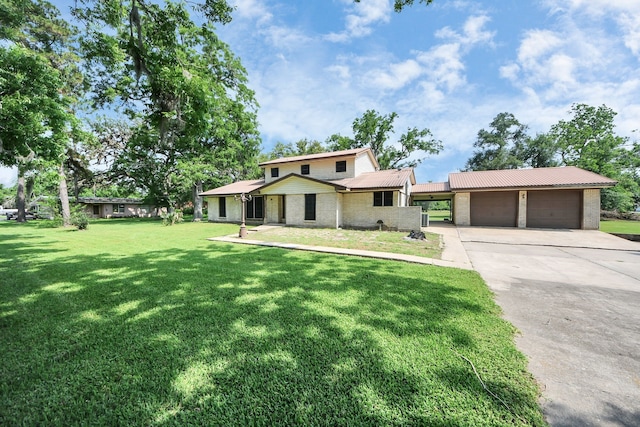 1417 Brigance Rd, Brazoria, TX 77422 - view of front of house featuring a garage, driveway, a front yard, and brick siding