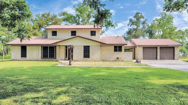 1417 Brigance Rd, Brazoria, TX 77422 - traditional-style home with brick siding, a garage, driveway, and a front yard