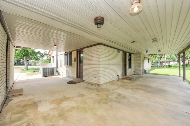 1417 Brigance Rd, Brazoria, TX 77422 - view of patio / terrace featuring a carport and central AC unit