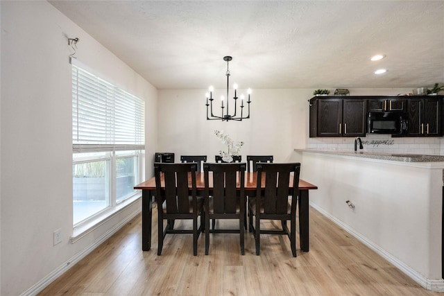 2814 Dustin Place Ct, Humble, TX 77396 - dining room featuring a chandelier, light wood-type flooring, baseboards, and recessed lighting