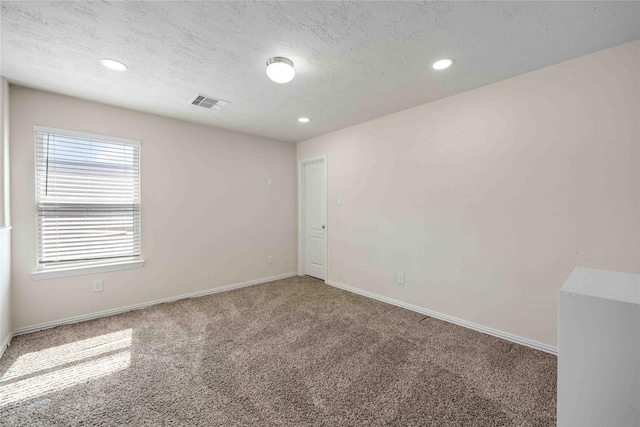 2814 Dustin Place Ct, Humble, TX 77396 - carpeted empty room featuring recessed lighting, baseboards, and a textured ceiling