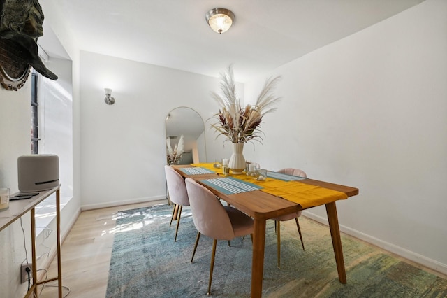2829 Timmons Ln Unit 184, Houston, TX 77027 - dining space with wood finished floors and baseboards