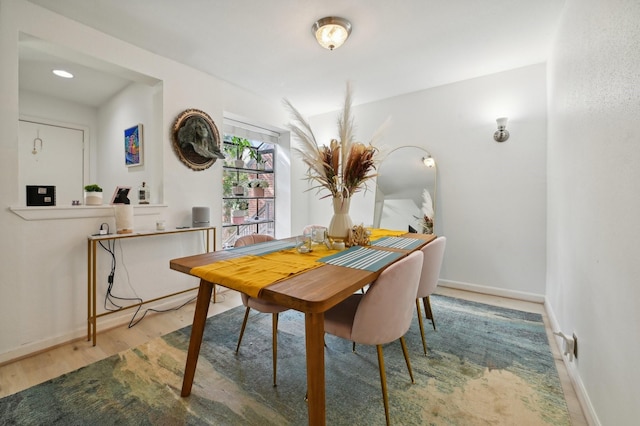2829 Timmons Ln Unit 184, Houston, TX 77027 - dining space with wood finished floors and baseboards