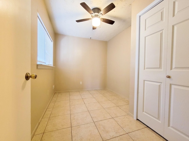 23930 Griffin House Ln, Katy, TX 77493 - spare room featuring a ceiling fan, light tile patterned floors, and baseboards