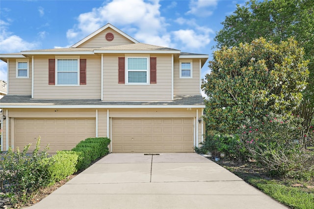 16106 Greenport Ln, Houston, TX 77084 - view of front of home featuring a garage, concrete driveway, and a shingled roof
