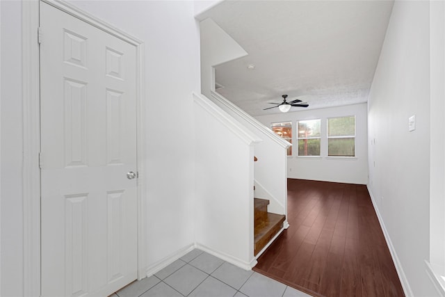 16106 Greenport Ln, Houston, TX 77084 - foyer featuring stairway, baseboards, a ceiling fan, and wood finished floors