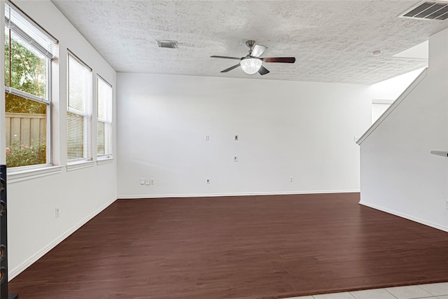16106 Greenport Ln, Houston, TX 77084 - empty room featuring wood finished floors, ceiling fan, a textured ceiling, and baseboards