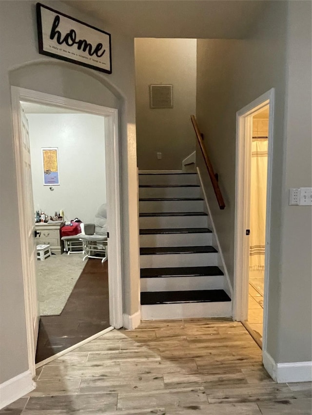 14720 Branchwest Dr, Houston, TX 77082 - staircase featuring wood finished floors and baseboards