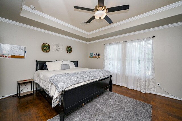 14720 Branchwest Dr, Houston, TX 77082 - bedroom featuring a tray ceiling, wood finished floors, crown molding, ceiling fan, and baseboards
