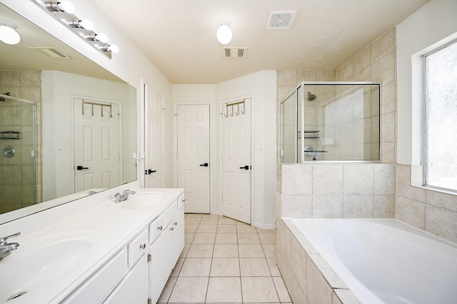 14720 Branchwest Dr, Houston, TX 77082 - full bathroom with a stall shower, a bath, tile patterned flooring, and double vanity